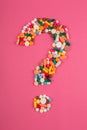 Question mark arranged from assorted pharmaceutical medicine pills, tablets and capsules Royalty Free Stock Photo