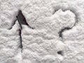 A question mark and arrow written in the snow. The cold frosty texture of the snow and the question mark. Background Royalty Free Stock Photo