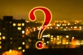 Question mark on blurred night city lights, abstract pattern background in bokeh effect Royalty Free Stock Photo