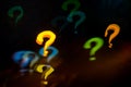 question mark Bokeh backdrop on dark background Royalty Free Stock Photo