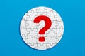 Question mark on a circle made out of puzzle pieces. Problem, mystery, doubt or frequently asked questions Royalty Free Stock Photo