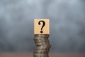 Question mark with coins stack on the gray background. Money offer concept. Mock up for different business ideas. Empty place for