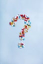 Question mark from Colorful medicines. Pills, tablets capsules. Medical concept How to choose a pharmaceutical product Royalty Free Stock Photo