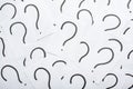 Question mark heap on table concept for confusion, question or solution Royalty Free Stock Photo