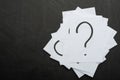 Question mark heap on table concept for confusion, question or solution Royalty Free Stock Photo