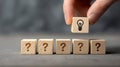 Question mark idea lightbulb solution concept choice decision wooden block hand creativity innovation thinking problem Royalty Free Stock Photo
