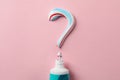 Question mark made of toothpaste and tube on background, copy space Royalty Free Stock Photo