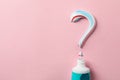 Question mark made of toothpaste and tube on background, copy space Royalty Free Stock Photo