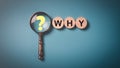 Question mark on magnifying glass and wooden block on a blue background, Questioning concepts, why, where, when, how, who ,to find