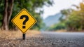 Question mark road sign on a blurred road Royalty Free Stock Photo