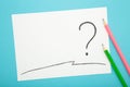 Question mark symbol on white paper with pencil on blue background Royalty Free Stock Photo