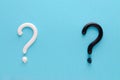 Question mark from white and black toothpaste on blue background Royalty Free Stock Photo