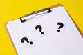 A question mark on a white sheet . FAQ frequency asked questions, Answer and Brainstorming Concepts Royalty Free Stock Photo