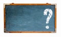 Question mark white sign with negative space for text on a blue old grungy vintage wide wooden chalkboard or retro blackboard Royalty Free Stock Photo