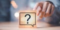 Question mark on wooden block, Questioning concepts, why, where, when, how, who ,to find the answer , and ask for help to solve Royalty Free Stock Photo