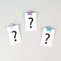 Question marks on paper, brainstorming and looking for answers, solving a problem, making a decision, business and education Royalty Free Stock Photo