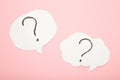 Question marks on white stickers on pink background Royalty Free Stock Photo