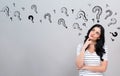 Question marks with young woman Royalty Free Stock Photo