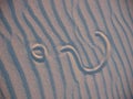 Questionmark in sand