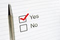 Questionnaire: yes no choice, marked check box with a pen on paper background. Approval concept Royalty Free Stock Photo