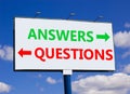 Questions and answers symbol. Concept word Questions Answers on beautiful billboard with two arrows. Beautiful blue sky with Royalty Free Stock Photo