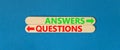 Questions and answers symbol. Concept word Questions Answers on beautiful wooden stick. Beautiful blue table blue background. Royalty Free Stock Photo