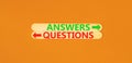 Questions and answers symbol. Concept word Questions Answers on beautiful wooden stick. Beautiful orange table orange background. Royalty Free Stock Photo