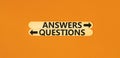 Questions and answers symbol. Concept word Questions Answers on beautiful wooden stick. Beautiful orange table orange background. Royalty Free Stock Photo