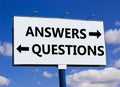 Questions and answers symbol. Concept word Questions Answers on beautiful billboard with two arrows. Beautiful blue sky with Royalty Free Stock Photo