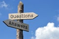 Questions and answers - wooden signpost with two arrows Royalty Free Stock Photo