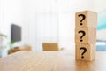 Questions Mark with wooden cube blocks on interior table background Royalty Free Stock Photo