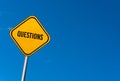 questions - yellow sign with blue sky Royalty Free Stock Photo