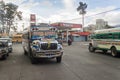 QUETZALTENANGO, GUATEMALA - MARCH 21, 2016: Colourful chicken buses, former US school buses, ride in Quetzaltenango cit