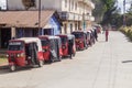 QUETZALTENANGO, GUATEMALA - MARCH 21, 2016: Tuk tuks wait in a lin