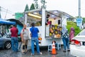 Queue at a mobile hot drinks kiosk in Malaysia