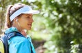 Queue nature playlist. woman listening to music on earphones while out for a trail run. Royalty Free Stock Photo