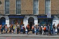 Queue on the sidewalk in front of the beatles store in bakerstreet