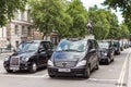 A queue of traditional British taxis
