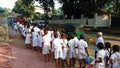 Sri Lankan school kids in queue to get in school bus , Kandy , Sri Lanka