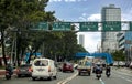 Quezon City, Metro Manila, Philippines - Moderate traffic along Quezon Avenue. Road signs elevated above the road. Royalty Free Stock Photo
