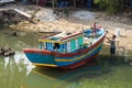 Qui Nhon, Vietnam - Apr 1, 2016: Fishing boat is painting by fisherman by river in Qui Nhon city, Tay Nguyen, central highlands of Royalty Free Stock Photo