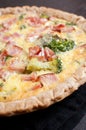 Quiche with broccoli and cut bacon or ham