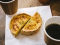 Quiche with hot coffee Cafe table top view Cafe culture