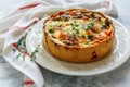 Quiche with salmon, broccoli,red pepper and thyme. Royalty Free Stock Photo