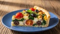 Quiche Slice with Tomato Olive Herb Cheese on Blue Plate Royalty Free Stock Photo