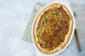 Quiche with spinach and cheese - savory tart from flaky dough on