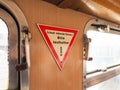 Quick-acting brake, please hold sign on German tram Royalty Free Stock Photo