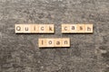 quick cash loan word written on wood block. quick cash loan text on table, concept Royalty Free Stock Photo