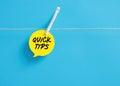 Quick tips on a speech bubble hanging on clothesline with a clothespin Royalty Free Stock Photo