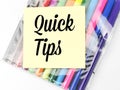 Quick tips written on yellow paper note with colorful pen.